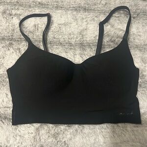 Never worn black Victoria Secret’s PINK wireless lightly lined bra. Size XS.